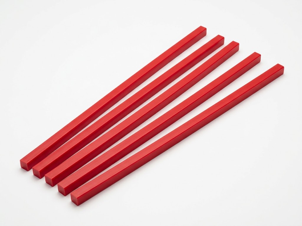 Illustration : réglettes de coupe rouges pour massicot